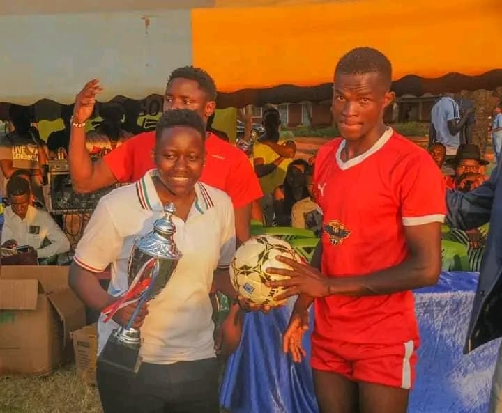 Winners of the first edition of the Ndege Super Cup organised by NALFA CBO in Siaya County, Kenya, celebrating with the championship trophy.