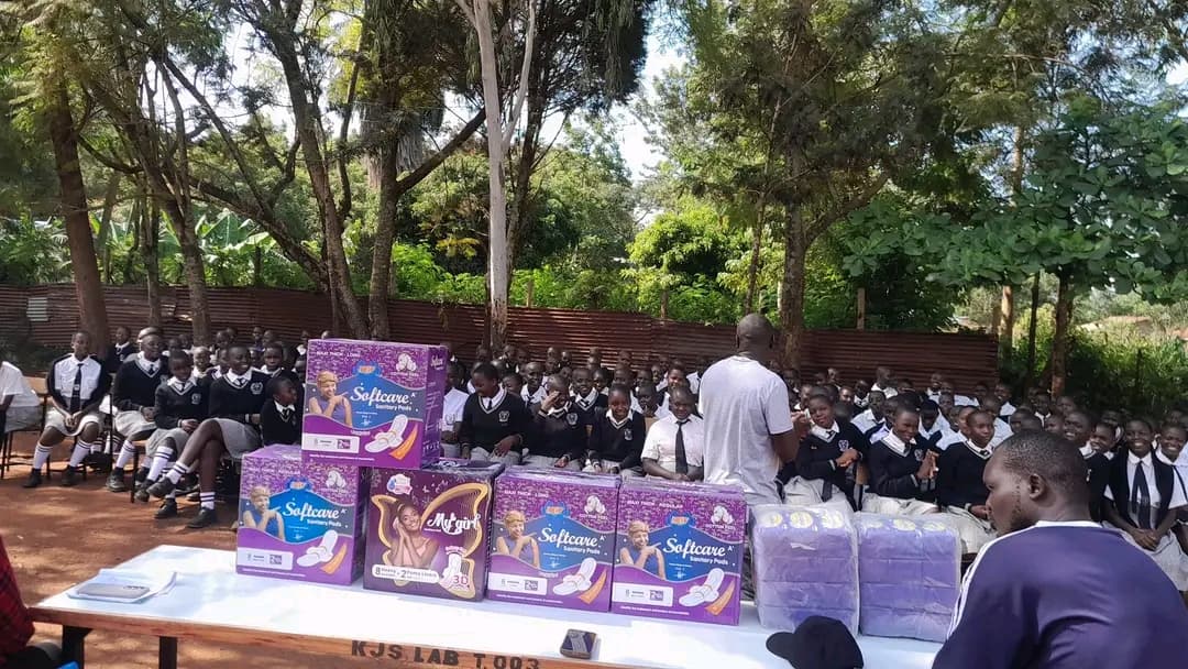 Students at Karapul Junior Secondary School receiving sanitary pads from NALFA CBO during a menstrual hygiene support programme in Siaya County, Kenya.