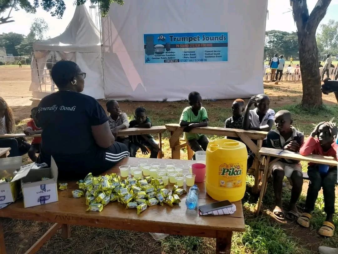 NALFA CBO volunteers engaging children during the Ndege Siaya Super Cup Tournament by providing free lunch, life skills, and educational talks to keep them active, inspired, and engaged throughout the school holidays.