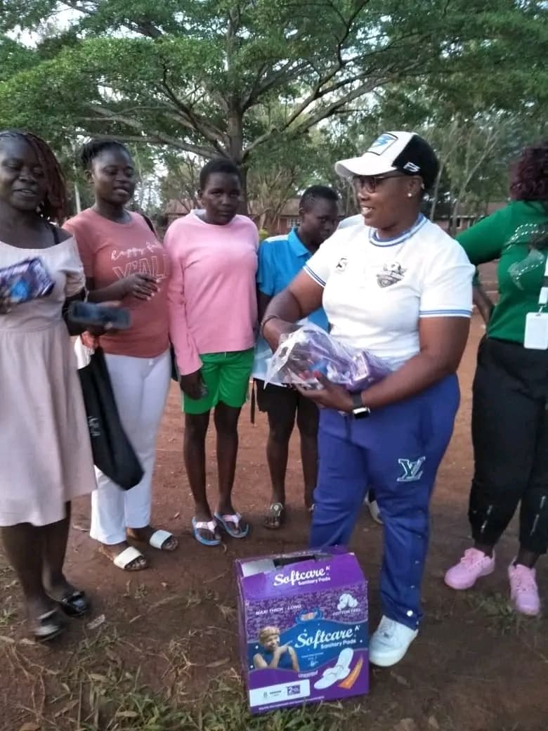 NALFA CBO volunteer distributing free sanitary pads to girls and women during the Ndege Siaya Super Cup tournament in Siaya County, Kenya.